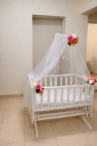 My white wooden baby Cradle  with canopy — gently used