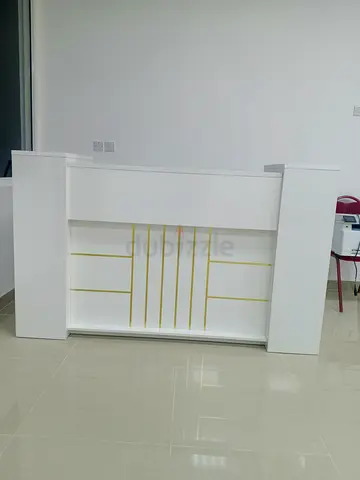 White reception counter / bar table with gold trim