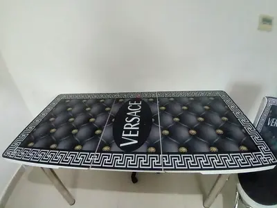 Versace-print glass top table with chrome legs and matching stool