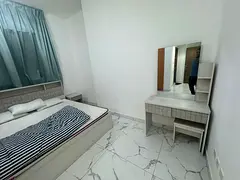 2bhkfor annual rent in Al Waha Towers, Ajman, with a sea view, two balconies, three bathrooms, maste