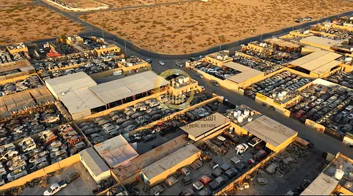 Industrial land for sale in the scrap yard, auto parts area, Al Sajaa Industrial Area, Sharjah. Area: 17,000 sq ft.