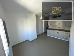 Spacious studio in Al Rashidiya 3, central AC, large kitchen, opposite bus station, AED 18K yearly,