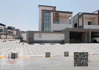 Villa for sale in Ajman Al Helio, 4 master bedrooms, a majlis, 2 living rooms, and a maid's room. Freehold for all nationalities. Bank financing is po