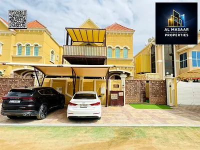 For sale in Al Muwaihat area, Ajman, steps away from the school complex and the Saudi German Hospital. Includes electricity, water, and air conditioni