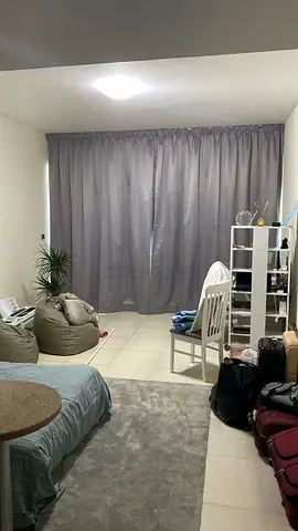 Grey full-length blackout curtains with ceiling u-rail mount