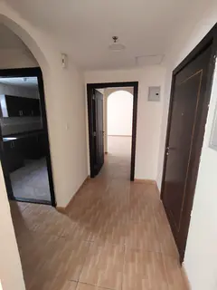 A spacious 1-bedroom apartment with a separate living room is available for annual rent in Al Qasimi