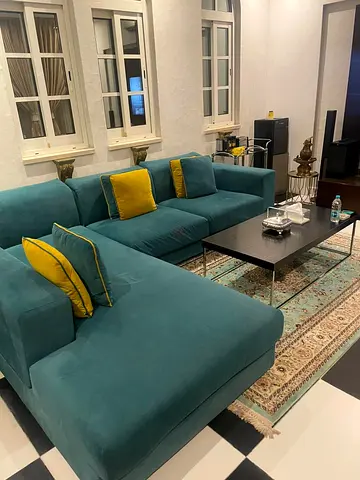 Lovely L-shaped sofa with center table and rocking chair for sale