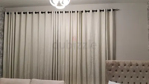 Full-length beige eyelet curtains — gently used