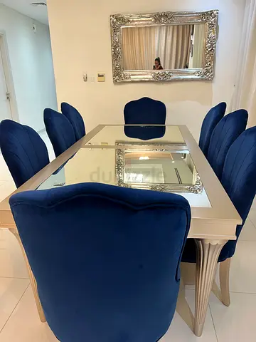 My mirrored dining table with 8 blue velvet chairs