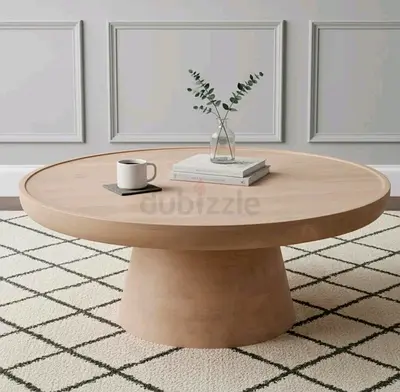 My round wooden pedestal coffee table - light oak