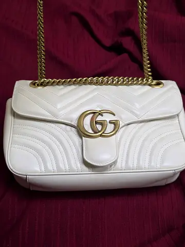 My white Gucci GG Marmont Small Matelassé shoulder bag with gold chain strap - good condition