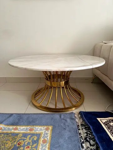 Round marble-top side table with gold metal base