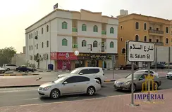 Commercial building, directly on Al-Salam Street, 10 years old, freehold