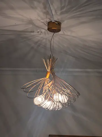 Modern wall-mounted metal sconce with glass bulb petals