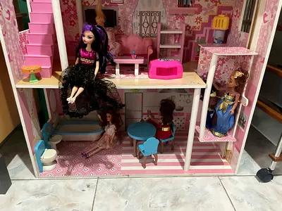 My pink dollhouse with two dolls and furniture and kitchen with cooking pans