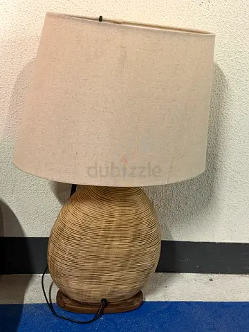 Woven rattan table lamp with beige fabric shade (used)