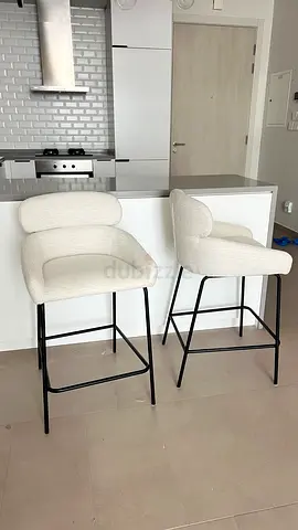 Set of 2 white-cream upholstered bar stools with black metal legs