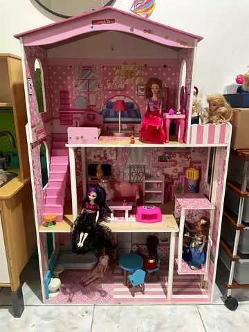 My pink dollhouse with two dolls and furniture and kitchen with cooking pans