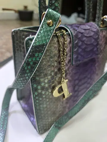 My green-purple snakeskin-effect womens handbag with chain charm