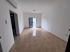 Two rooms with a hall at a special price for annual rent in Rashdiyeh, Ajman, excellent location, cl