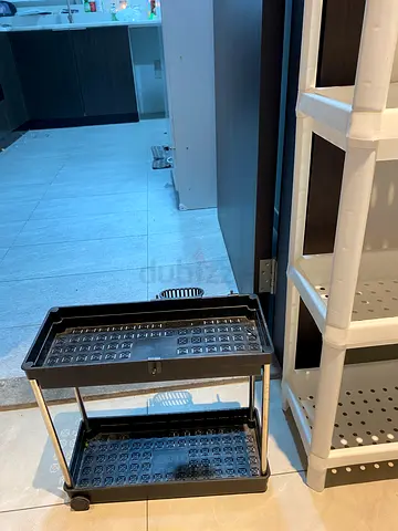 Set of plastic bathroom storage shelves