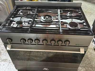 Used stainless steel 5-burner gas range with oven