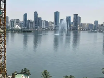 Free AC with gym and pool in a vibrant, prime location close to all services like cafes and shops, and near the Dubai exit.