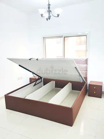 Brown upholstered storage bed with hydraulic lift
