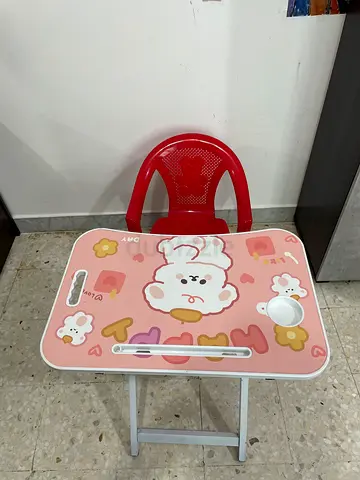 My childs pink bear table with red chair