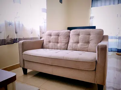 Tufted 2-seater fabric sofa - Home Center - Good Condition
