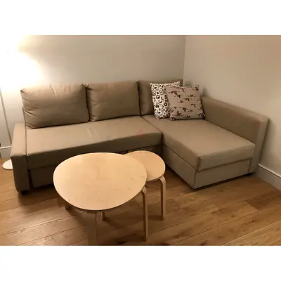 Beige L-shaped corner sofa with chaise — good condition