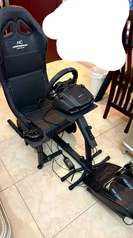 Racing simulator rig with seat, wheel, pedals and shifter