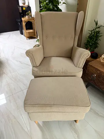 Light gray  wingback armchair with matching ottoman (used)
