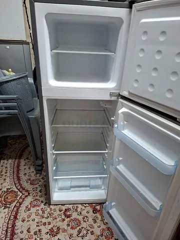 Used compact top-freezer refrigerator — clean and working