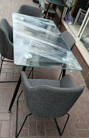 Modern Glass Dining Table with Grey Chairs