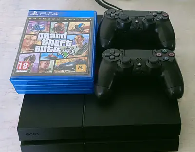 Ps4 with 2 controllers and 4 games for sale