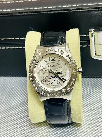 Police silver star-bezel watch with black leather strap
