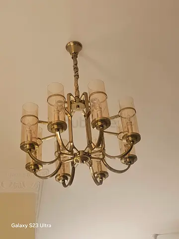 PAIR of multi-arm brass chandelier with smoked glass shades