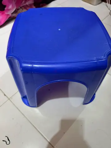 Blue plastic stool — compact and lightweight