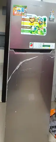 Used two-door refrigerator (top freezer) — with warranty. Rarely used . Remains in good condition.