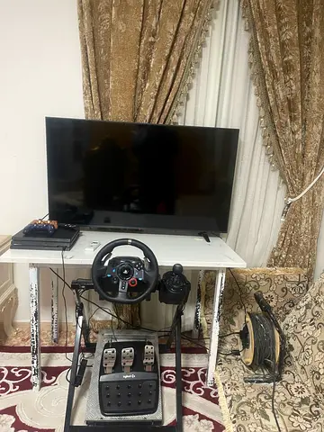 PlayStation4 pro and staring wheel with gear