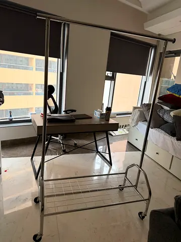 Steel cloth hanger with shelf and wheels