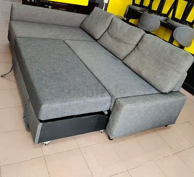 My grey fabric 3-seater sofa bed with storage - good condition