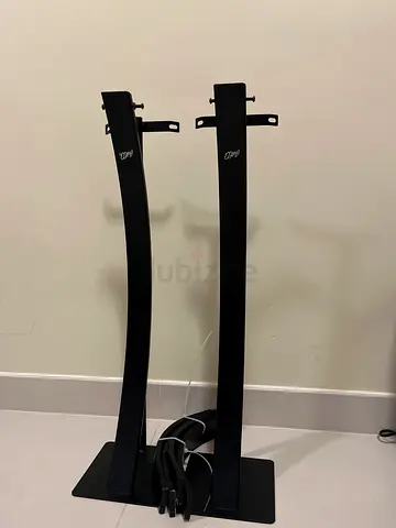 Pair of black curved floor speaker stands