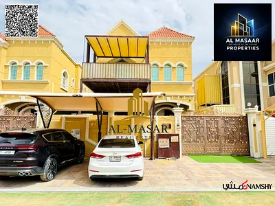 Villa for sale in Al Muwaihat area, Ajman, steps away from the school complex and the Saudi German Hospital. Includes electricity, water, and air cond