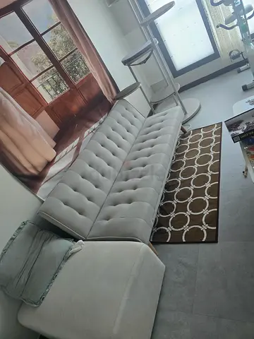 Light grey tufted  sofa bed with chaise - good condition