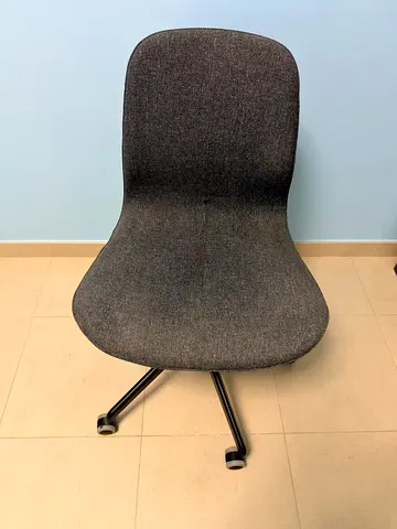 IKEA’s grey  fabric chair with rolling metal base