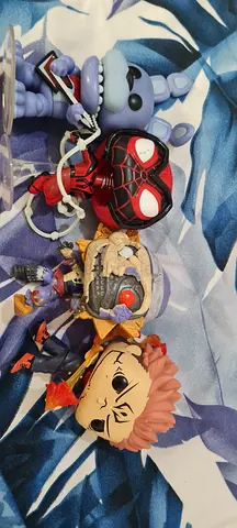 Set of 4 funko pop collectible figures — mixed characters