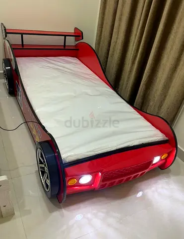 Kids red car toddler bed with built-in lights and mattress. Brand: HOME BOX