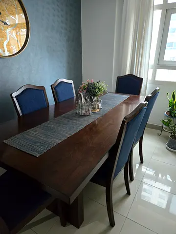 Home Center - wooden dining table with 6 blue upholstered chairs - very good condition